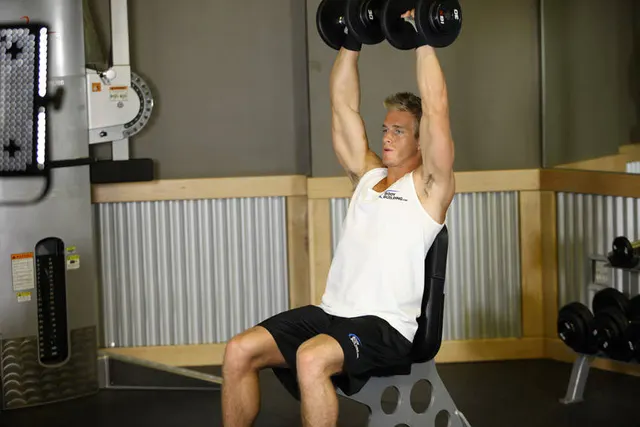 Arnold Dumbbell Press, finishing position