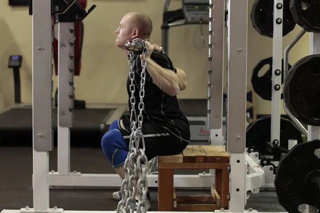 Box Squat with Chains, finishing position