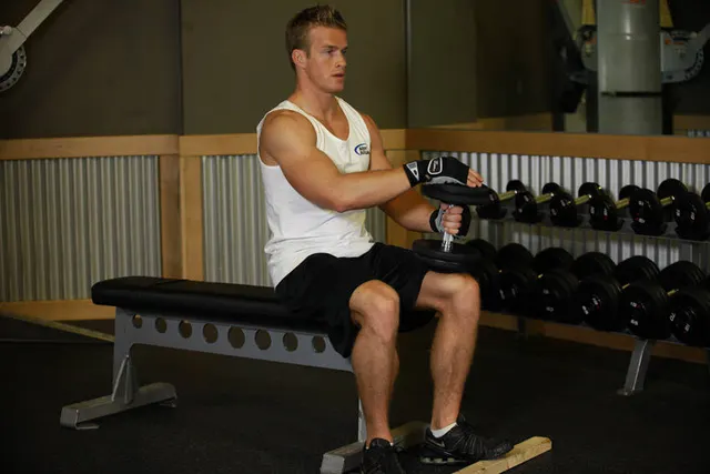 Dumbbell Seated One-Leg Calf Raise, finishing position