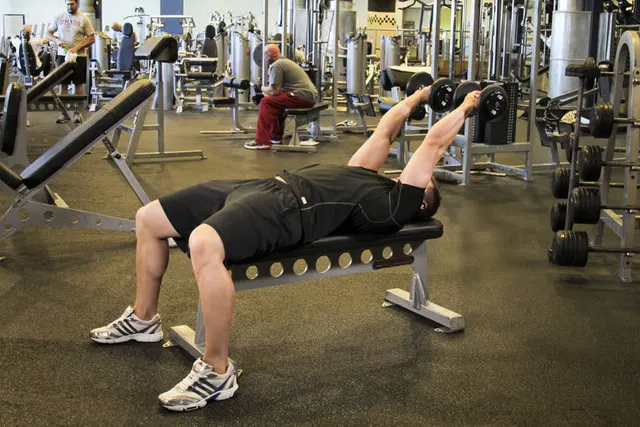 Dumbbell Tricep Extension -Pronated Grip, finishing position