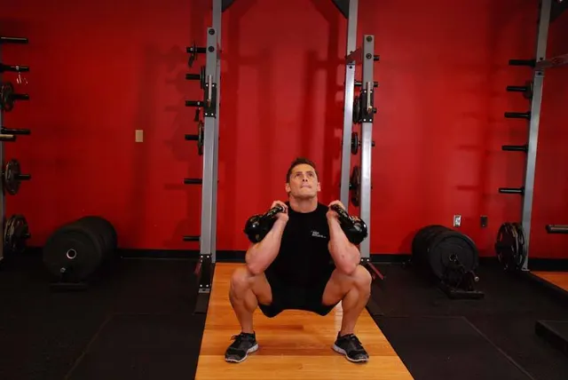 Front Squats With Two Kettlebells, finishing position