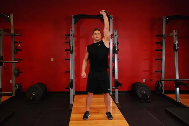 Kettlebell Arnold Press, finishing position