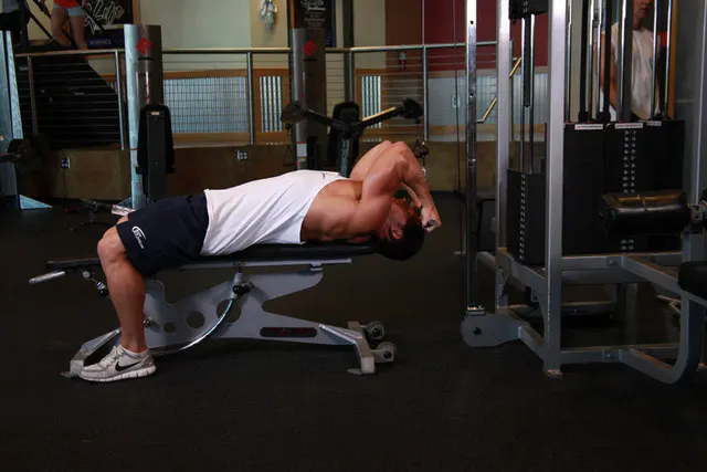Lying Close-Grip Bar Curl On High Pulley, finishing position