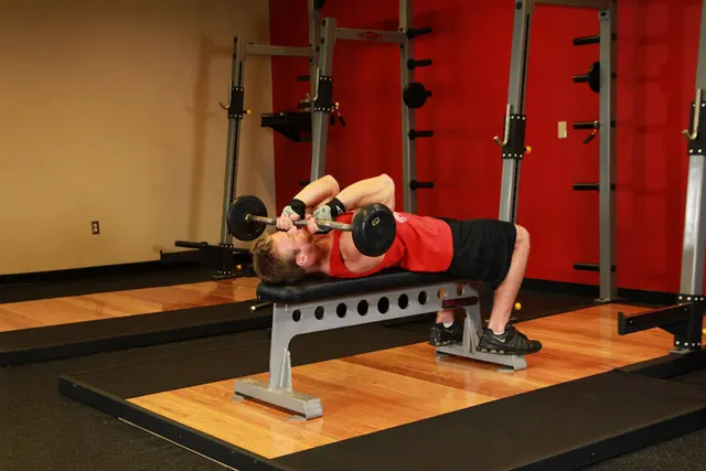 Lying Close-Grip Barbell Triceps Press To Chin, finishing position
