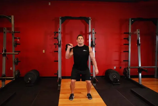 One-Arm Kettlebell Jerk, finishing position