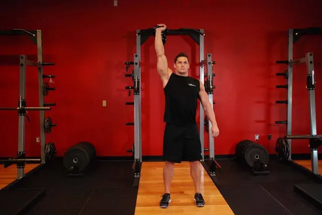 One-Arm Kettlebell Para Press, finishing position
