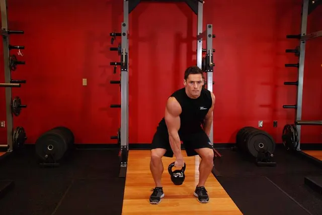 One-Arm Kettlebell Split Snatch, finishing position