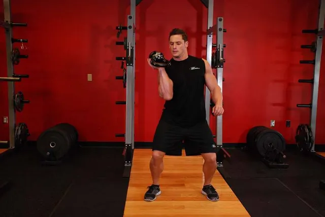 One-Arm Open Palm Kettlebell Clean, finishing position