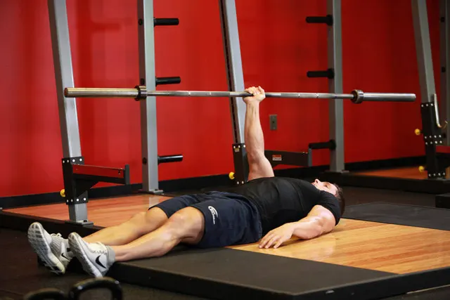 One Arm Floor Press, finishing position