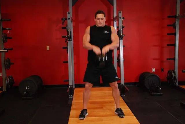 Open Palm Kettlebell Clean, finishing position