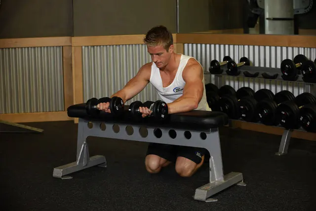 Palms-Down Dumbbell Wrist Curl Over A Bench, finishing position
