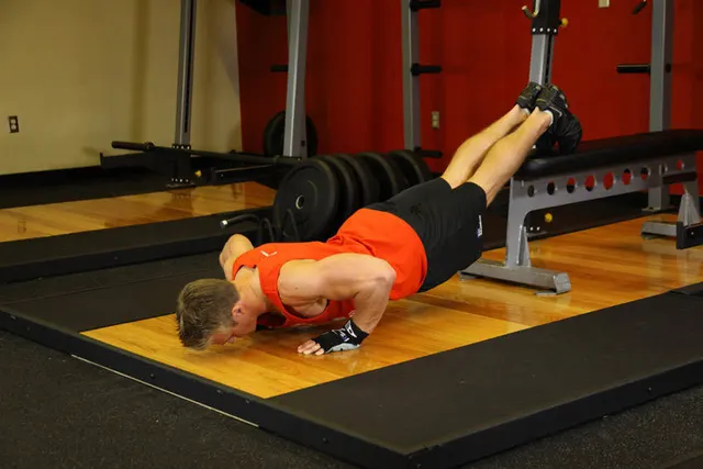 Push-Ups With Feet Elevated, finishing position