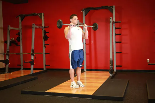 Reverse Barbell Curl, finishing position