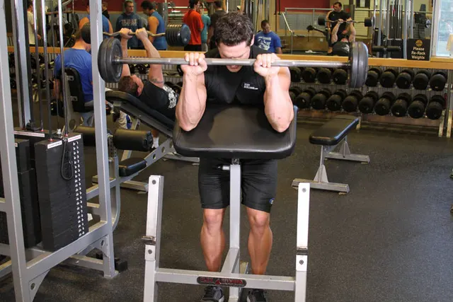 Reverse Barbell Preacher Curls, finishing position