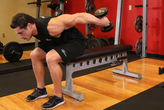 Seated Bent-Over Two-Arm Dumbbell Triceps Extension, finishing position