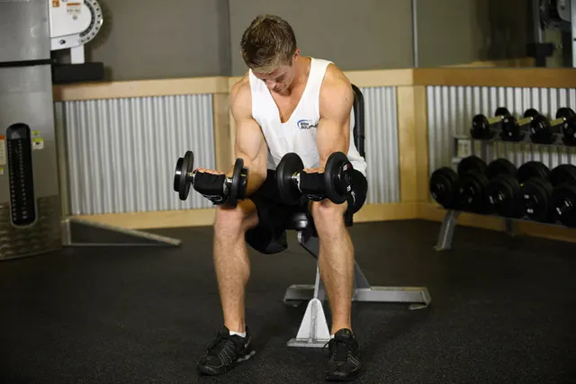 Seated Dumbbell Palms-Up Wrist Curl, finishing position
