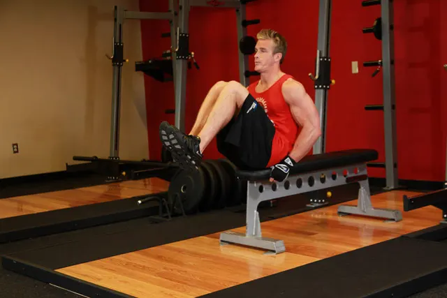 Seated Flat Bench Leg Pull-In, finishing position
