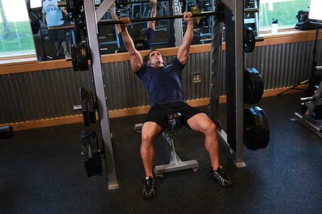 Smith Incline Shoulder Raise, finishing position