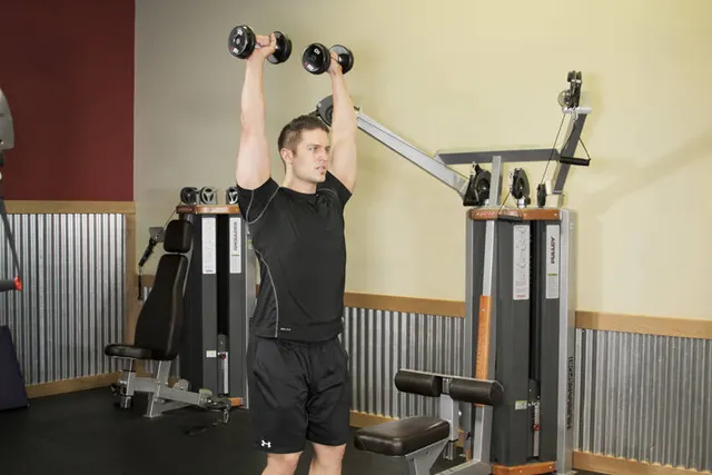 Standing Dumbbell Press, finishing position