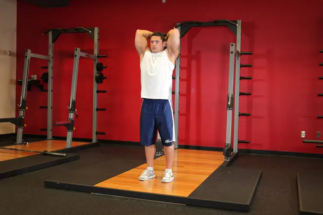 Standing Dumbbell Triceps Extension, finishing position