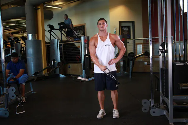 Standing Low-Pulley Deltoid Raise, finishing position