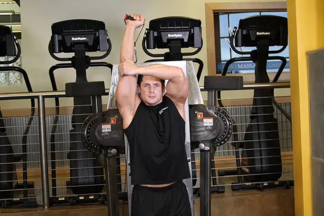 Standing Low-Pulley One-Arm Triceps Extension, finishing position