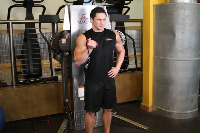 Standing One-Arm Cable Curl, finishing position