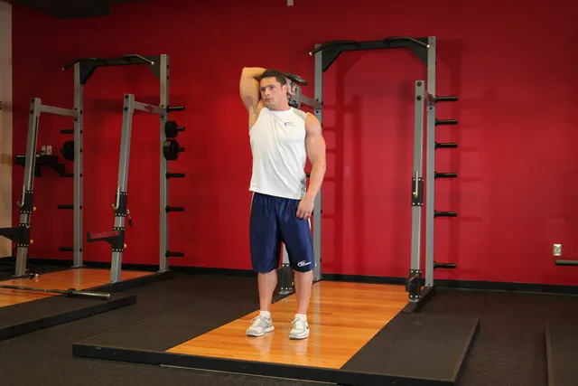 Standing One-Arm Dumbbell Triceps Extension, finishing position