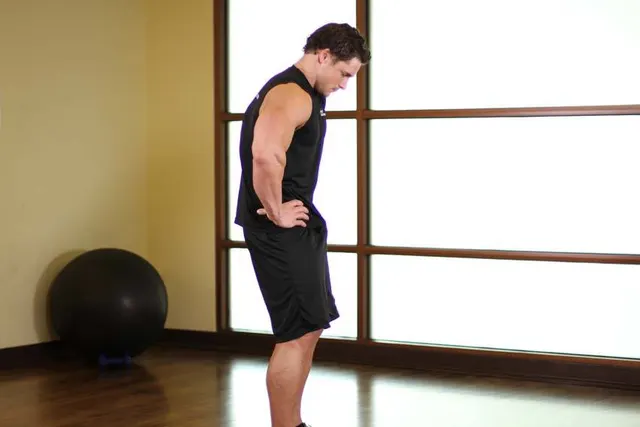 Standing Pelvic Tilt, finishing position