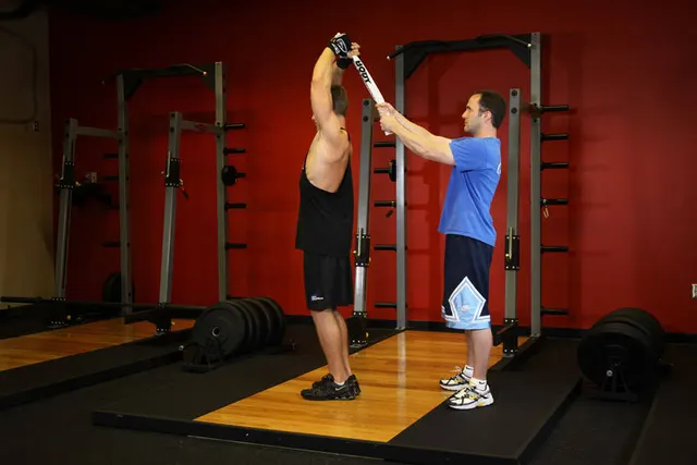 Standing Towel Triceps Extension, finishing position