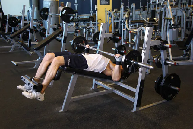Wide-Grip Decline Barbell Bench Press, finishing position