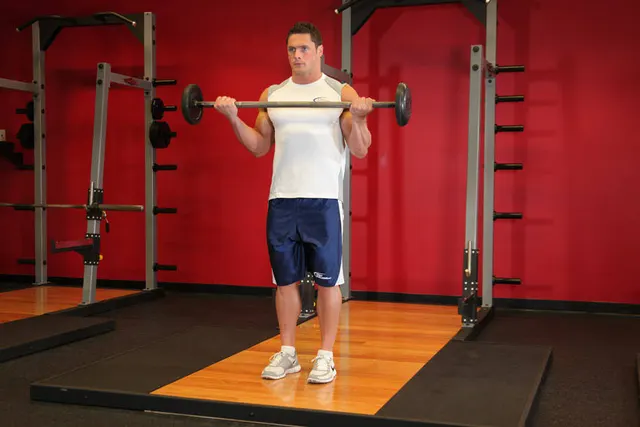 Wide-Grip Standing Barbell Curl, finishing position